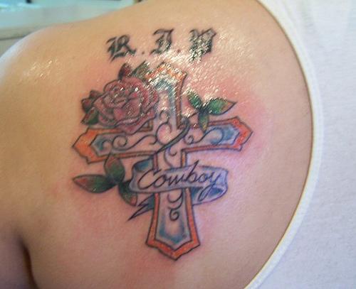 Memorial Cross With Banner And Rose Tattoo On Left Back Shoulder