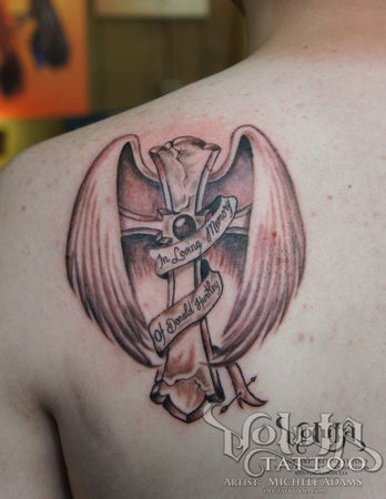 Memorial Cross With Wings And Banner Tattoo On Left Back Shoulder
