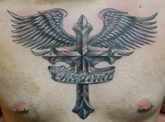 Memorial Cross With Wings And Banner Tattoo On Man Chest