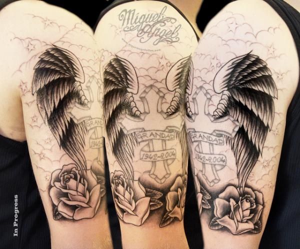 Memorial Cross With Wings And Roses Tattoo On Right Half Sleeve