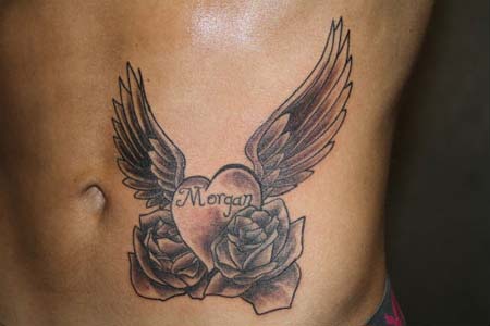 Memorial Heart With Wings And Roses Tattoo On Stomach