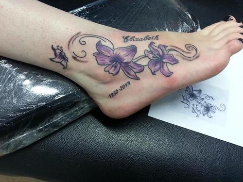 Memorial Purple Flowers Tattoo On Girl Foot For Grandma