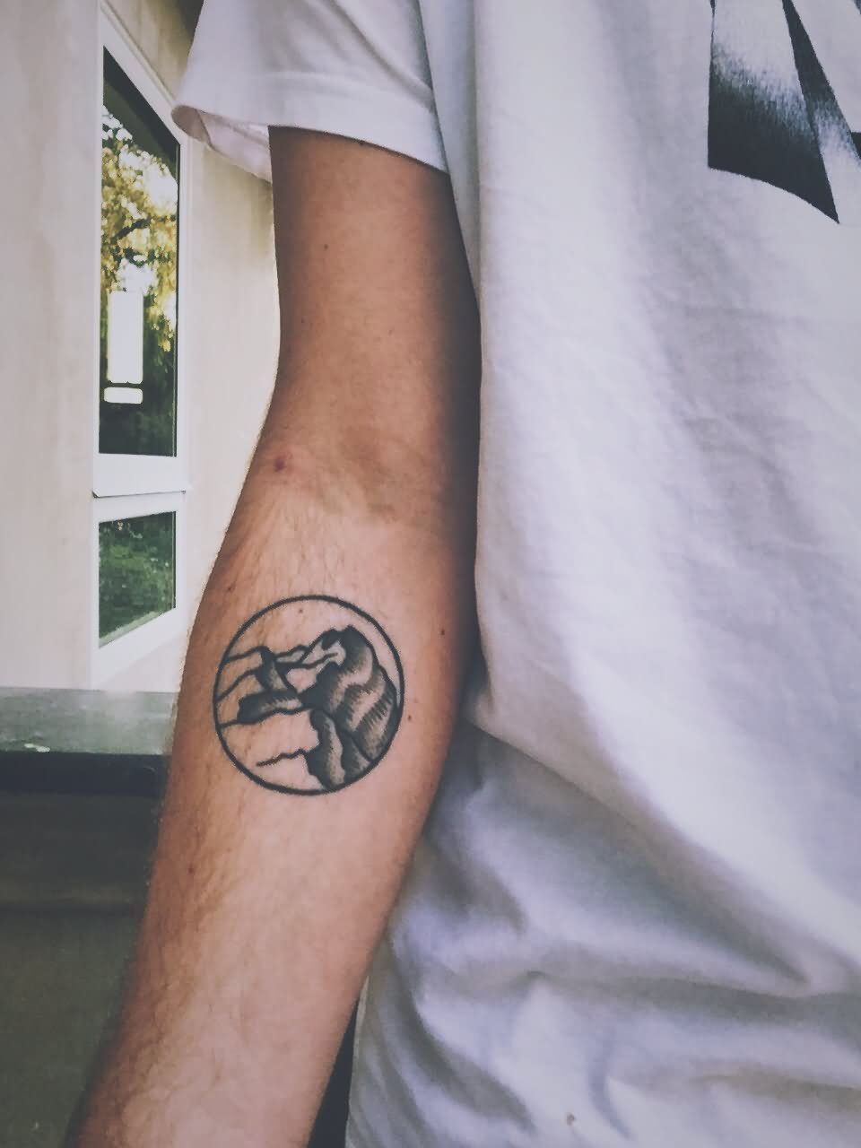 Mountain In Circle Tattoo On Right Forearm