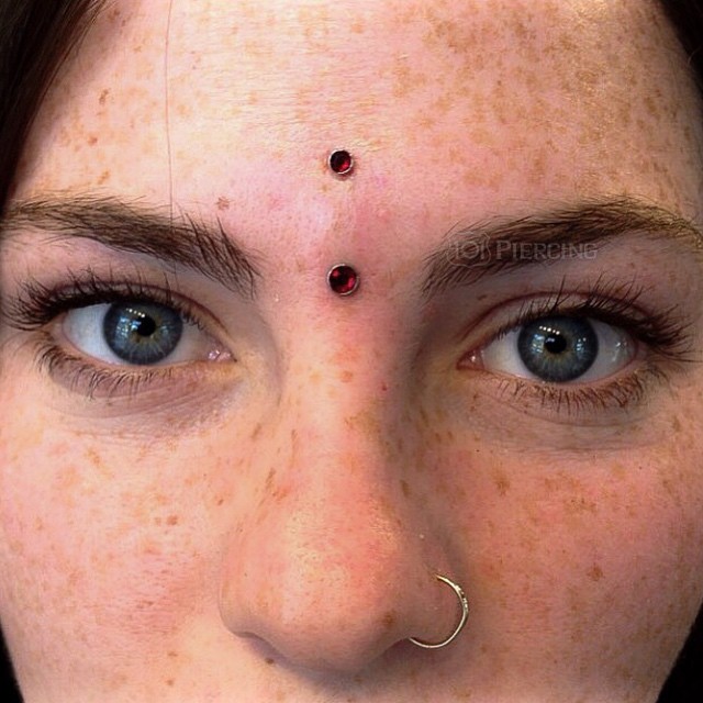 Nice Left Nostril And Bindi Piercing With Red Gems