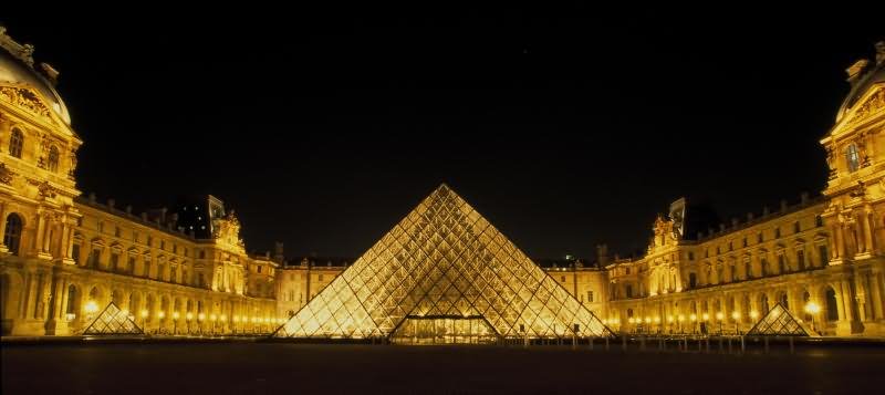 Night Panorama Shot Of Louvre Museum And The Glass Pyramid