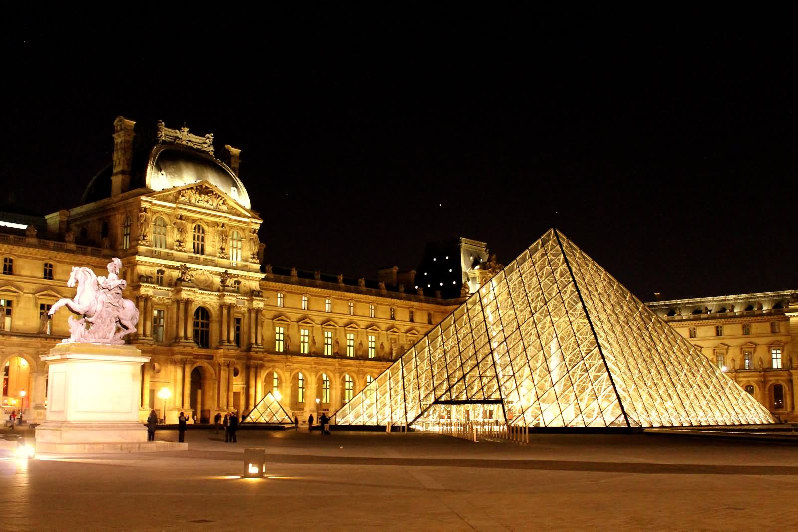 Night View Of Louvre Museum And Glass Pyramid
