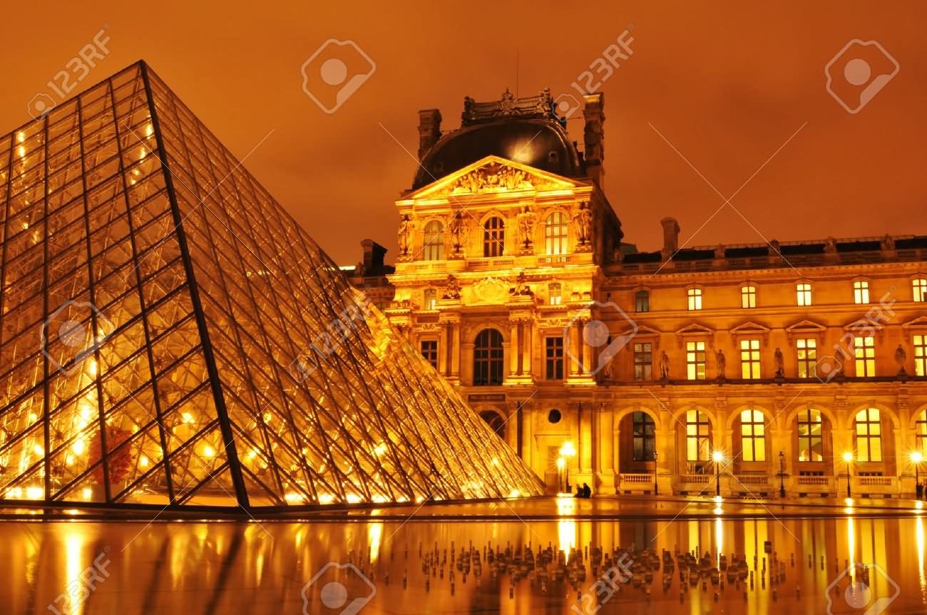 Night View Of Louvre Museum With Glass Pyramid