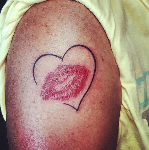 Outline Heart And Lip Print Tattoo On Left Shoulder