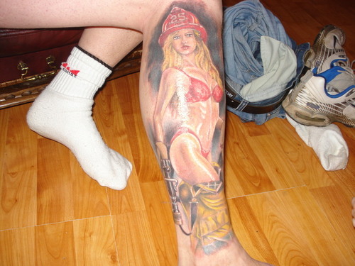 Pin Up Firefighter Girl Tattoo On Right Leg