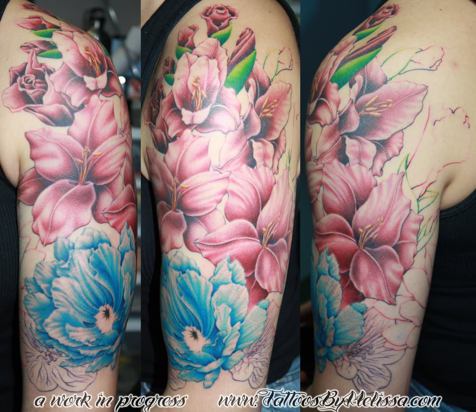 Pink And Blue Realistic Floral Tattoo On Half Sleeve