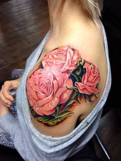 Pink Ink Floral Tattoo On Girl Left Shoulder