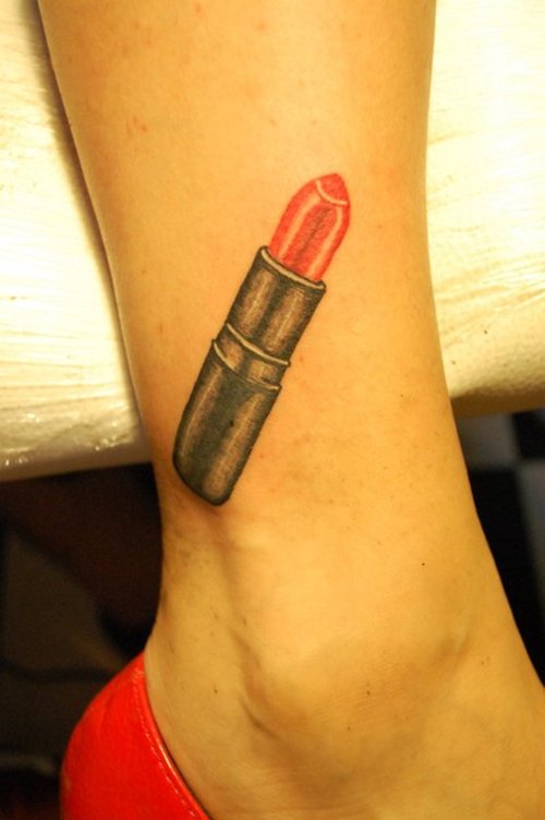 Pink Lipstick Tattoo On Girl Leg