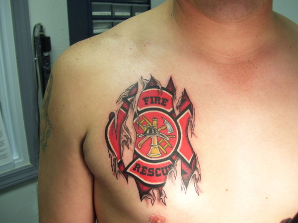 Ripped Skin Tribal Firefighter Logo Tattoo On Man Chest