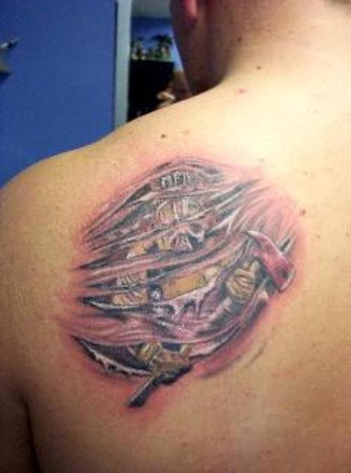 Ripped Skin Tribal Firefighter Tattoo On Left Back Shoulder