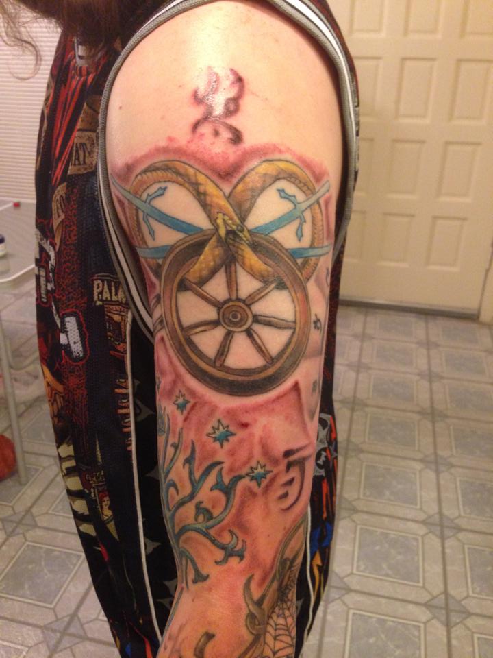 Sailor Wheel Fantasy Tattoo On Left Sleeve