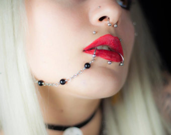 Septum And Lower Lip Chain Piercing