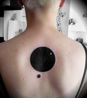 Silhouette Circle Tattoo On Upper Back
