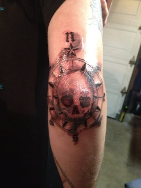 Skull With Compass Tattoo On Right Elbow
