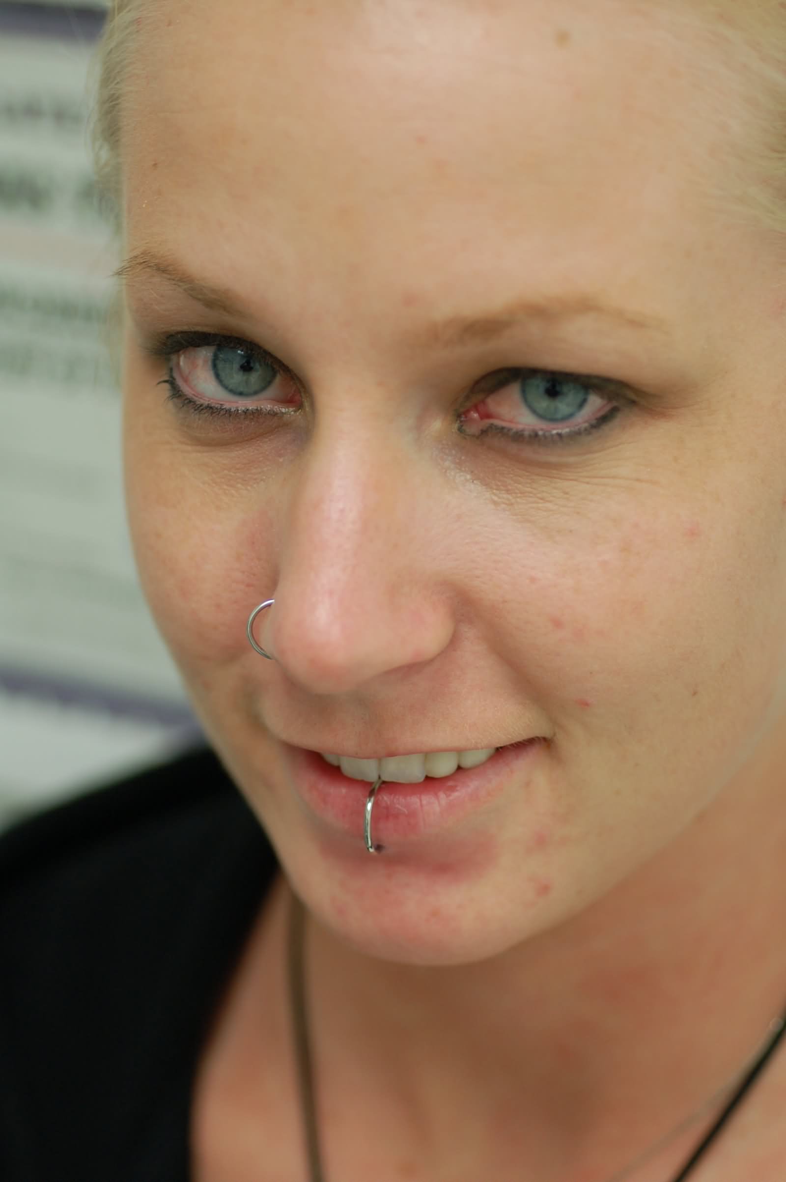 Smiling Girl With Right Nostril And Center Labret Piercing