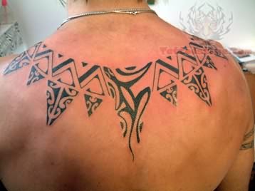 Taino Sun Tattoo Design On Man Upper Back