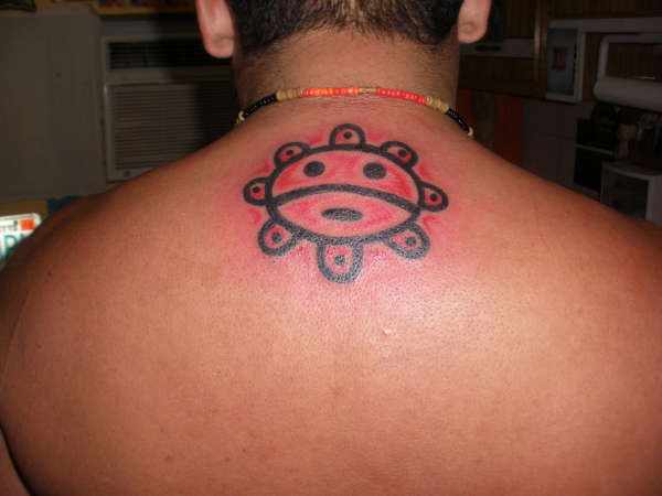 Taino Sun Tattoo On Man Upper Back