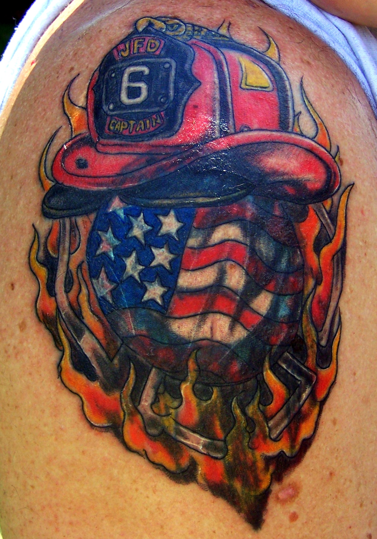 USA Flag With Firefighter Helmet In Flame Tattoo On Shoulder