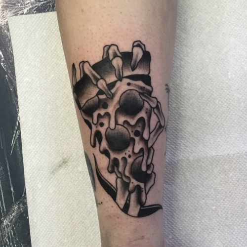 Black And White Pizza In Skeleton Hand Tattoo Design For Arm