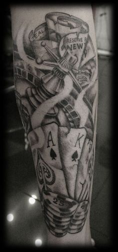 Grey Ink Playing Cards And Gambling Money Tattoo On Sleeve