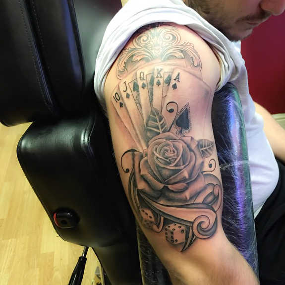 Grey Rose And Playing Cards Gambling Tattoo On Sleeve
