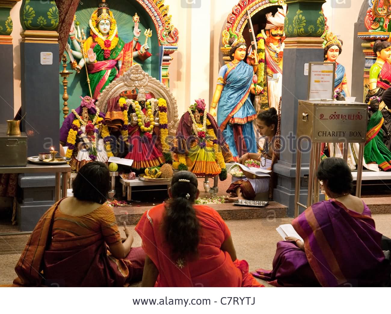 Hindu Worshippers And Deities Inside The Sri Mariamman Temple, Singapore