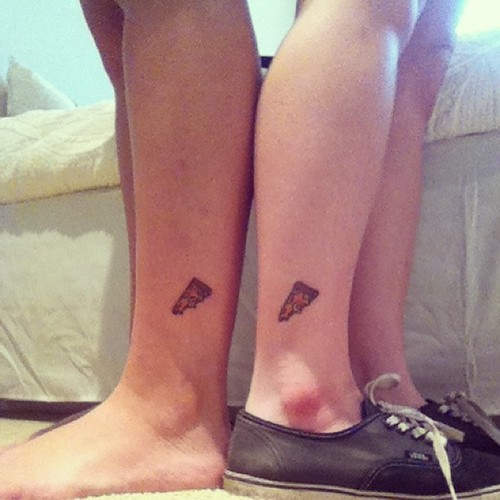 Little Pizza Piece Tattoo On Couple Leg