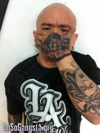 Black Ink Gangster Skull Tattoo On Hand