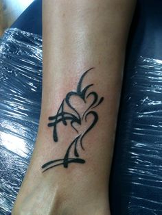 Black Tribal Heart Friendship Tattoo On Leg