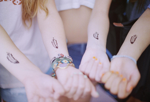 Cute Feather Friendship Tattoos On Forearm