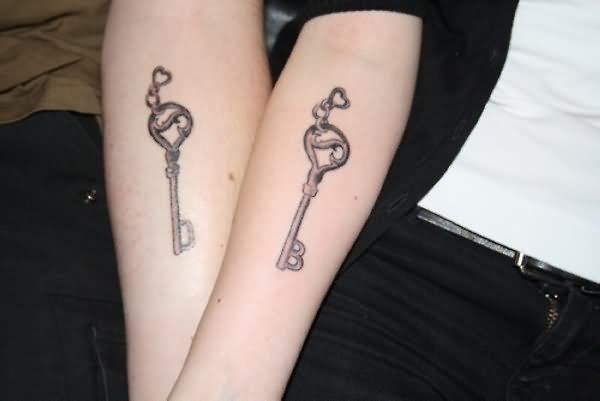 Friendship Key Tattoos On Both Girls Arm