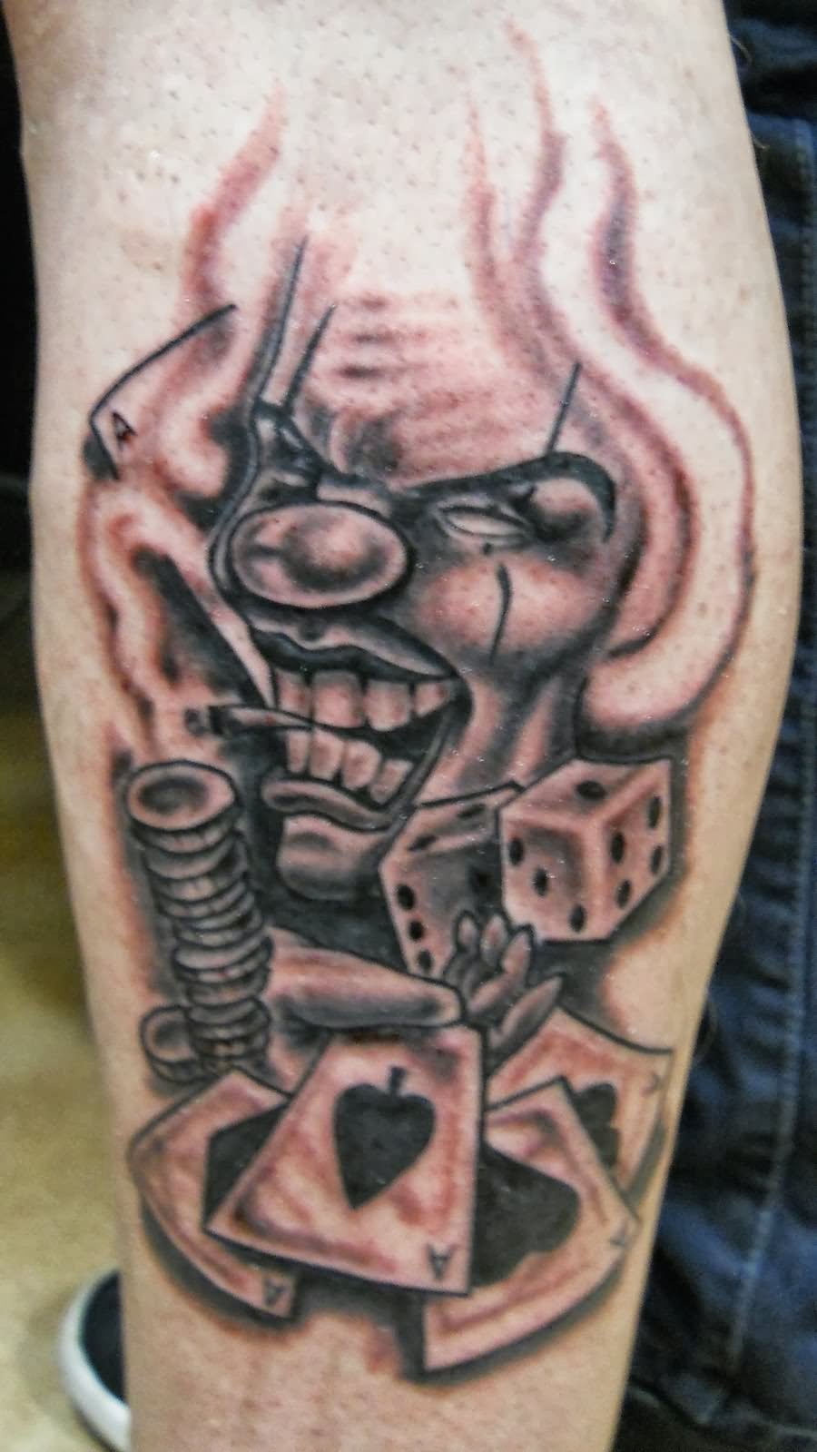 Gangster Clown With Playing Cards And Cubes Tattoo Design For Leg