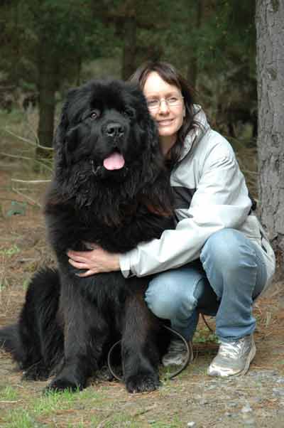Girl With Black Newfoundland Dog