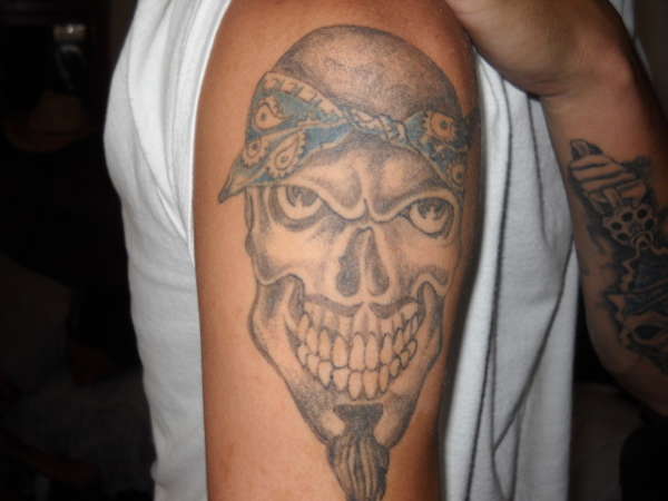 Grey Ink Gangster Skull Tattoo On Man Right Shoulder