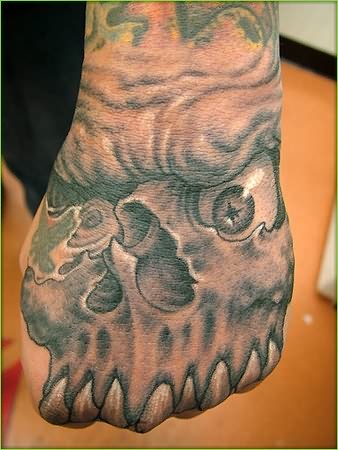 Grey Ink Mexican Gangster Skull Tattoo On Hand