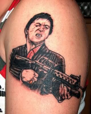 Gun In Gangster Hand Tattoo Design For Shoulder