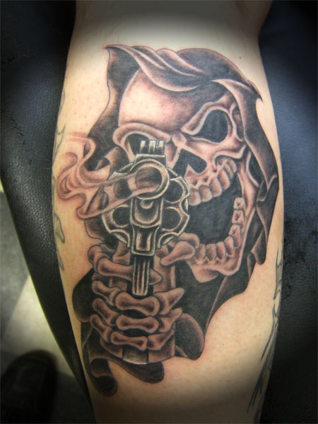 Gun In Mexican Gangster Skull Hand Tattoo Design