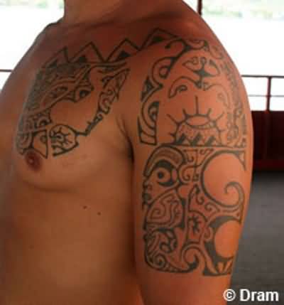 Ancient Hawaiian Design Tattoo On Man Left Shoulder And Chest