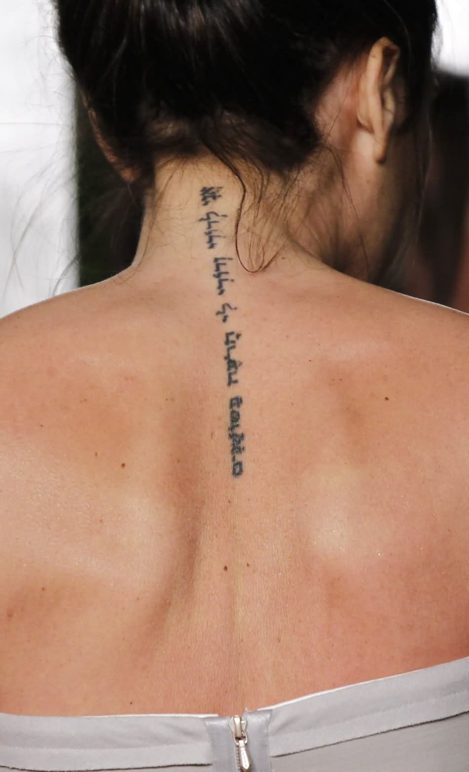 Attractive Hebrew Phrases Tattoo On Girl Upper Back