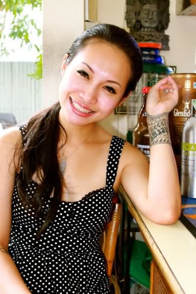 Awesome Hawaiian Band Tattoo On Girl Left Wrist