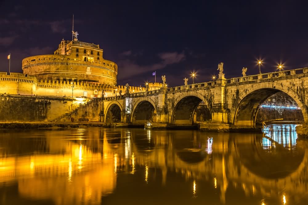 Beautiful Night Lights View At Castel Sant'Angelo On The Tiber River