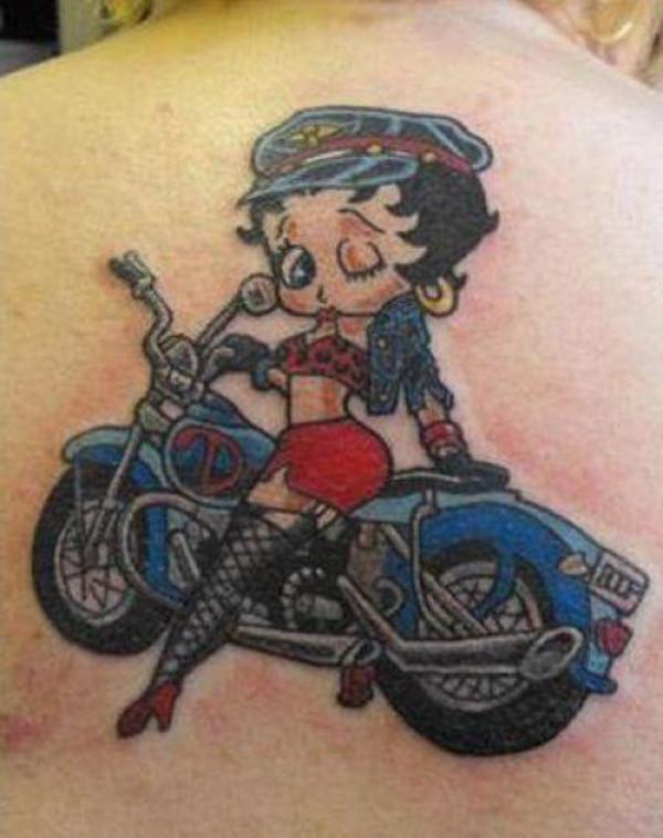Betty Boop Riding Motorbike Tattoo On Upper Back