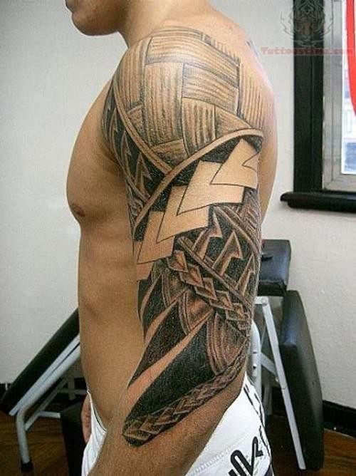 Black And Grey Hawaiian Design Tattoo On Man Left Half Sleeve