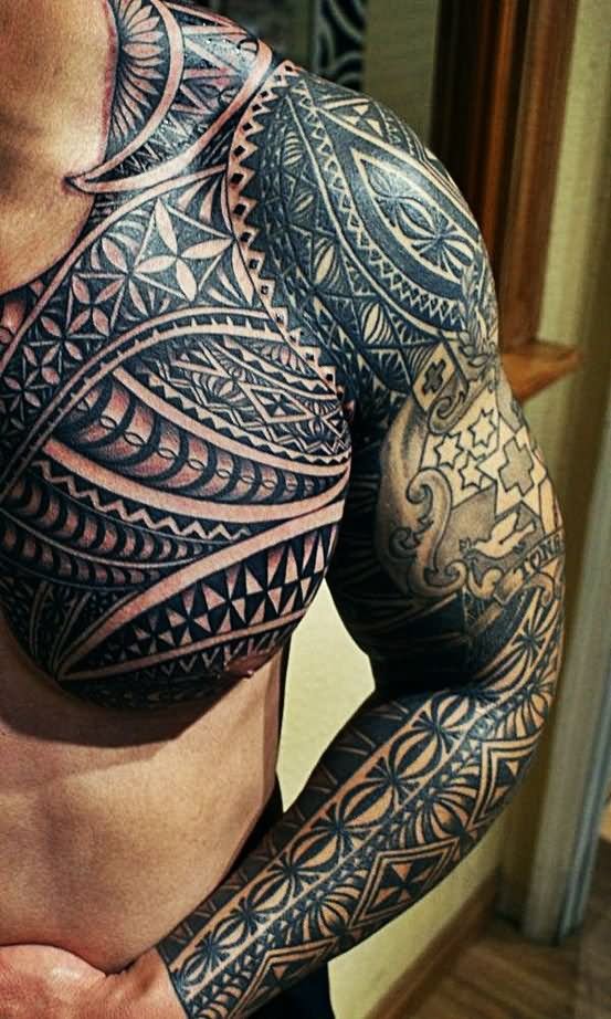 Black And Grey Hawaiian Design Tattoo On Man Left Sleeve And Chest