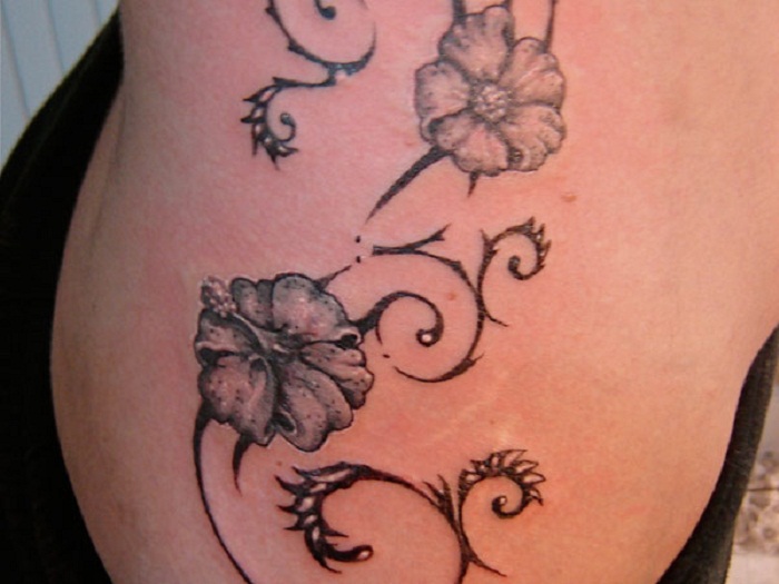 Black And Grey Hawaiian Flowers Tattoo Design