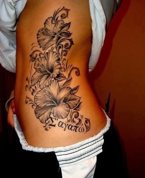 Black And Grey Hawaiian Flowers Tattoo On Girl Side Rib